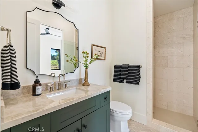 a bedroom with a large bed and a couch