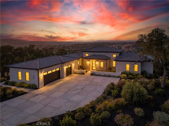 a front view of a house with yard