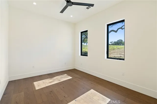 a bedroom with a large bed and a couch