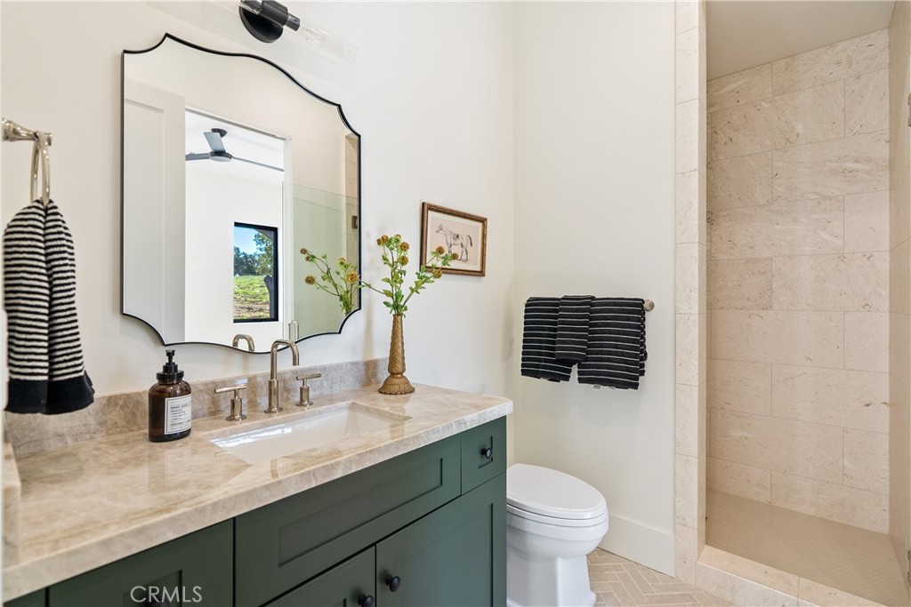 2220 Battering Rock Road Templeton, CA 93465 - Photo 24 of 57 a bathroom with a granite countertop sink toilet and mirror