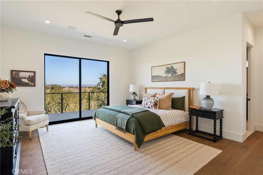 2220 Battering Rock Road Templeton, CA 93465 - Photo 24 of 59 a bedroom with a large bed and a large window