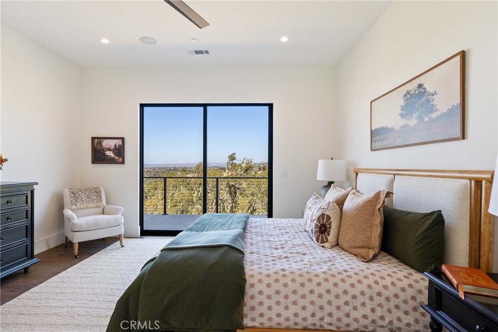 2220 Battering Rock Road Templeton, CA 93465 - Photo 25 of 59 a bedroom with a large bed and a couch
