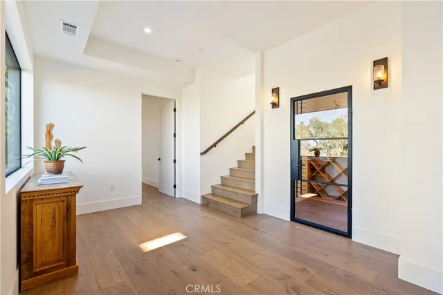 a bedroom with a bed and a potted plant