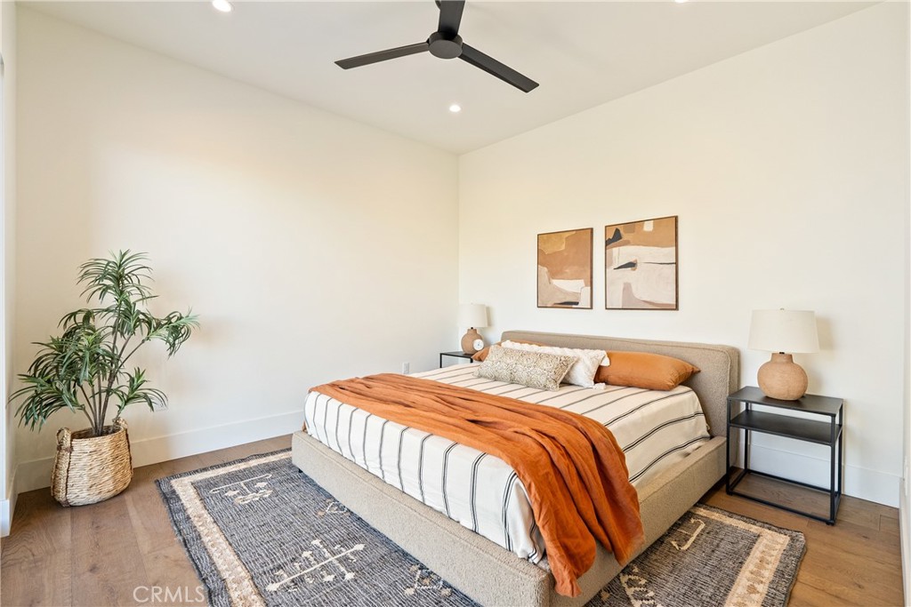 2220 Battering Rock Road Templeton, CA 93465 - Photo 35 of 59 a bedroom with a bed and a potted plant