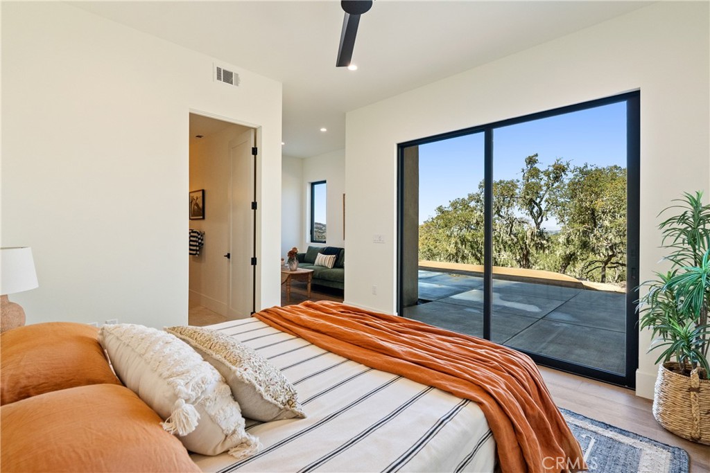 2220 Battering Rock Road Templeton, CA 93465 - Photo 37 of 57 a bedroom with a bed and a potted plant