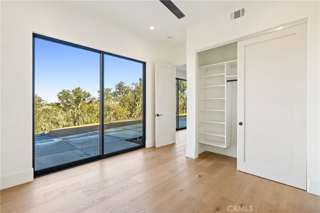 a living room with a large window and a floor
