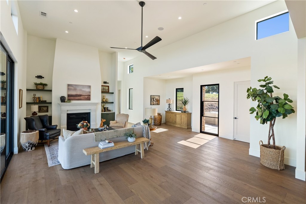 2220 Battering Rock Road Templeton, CA 93465 - Photo 5 of 59 a living room with furniture fireplace and potted plant