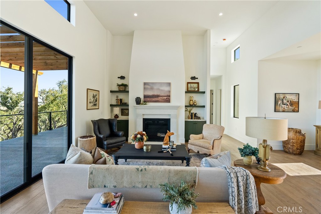 2220 Battering Rock Road Templeton, CA 93465 - Photo 5 of 57 a living room with furniture fireplace and a large window