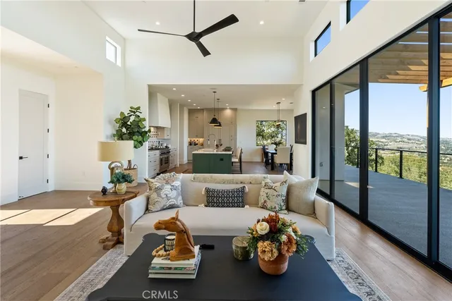 a bedroom with furniture and a large window