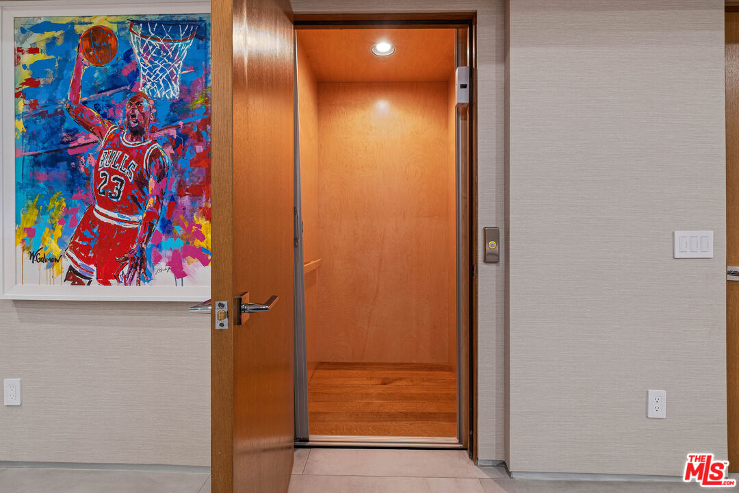 17405 Castellammare Drive Pacific Palisades, CA 90272 - Photo 24 of 29 a view of a elevator with wooden floor