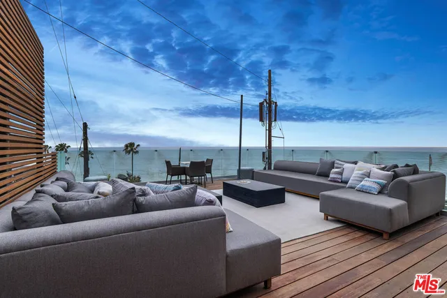 a outdoor living space with furniture and a fireplace