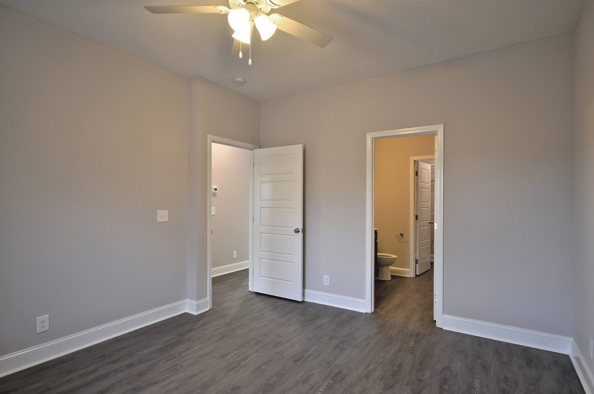 174 Bainbridge Drive, Unit A Clarksville, TN 37043 - Photo 24 of 36 an empty room with wooden floor and closet area