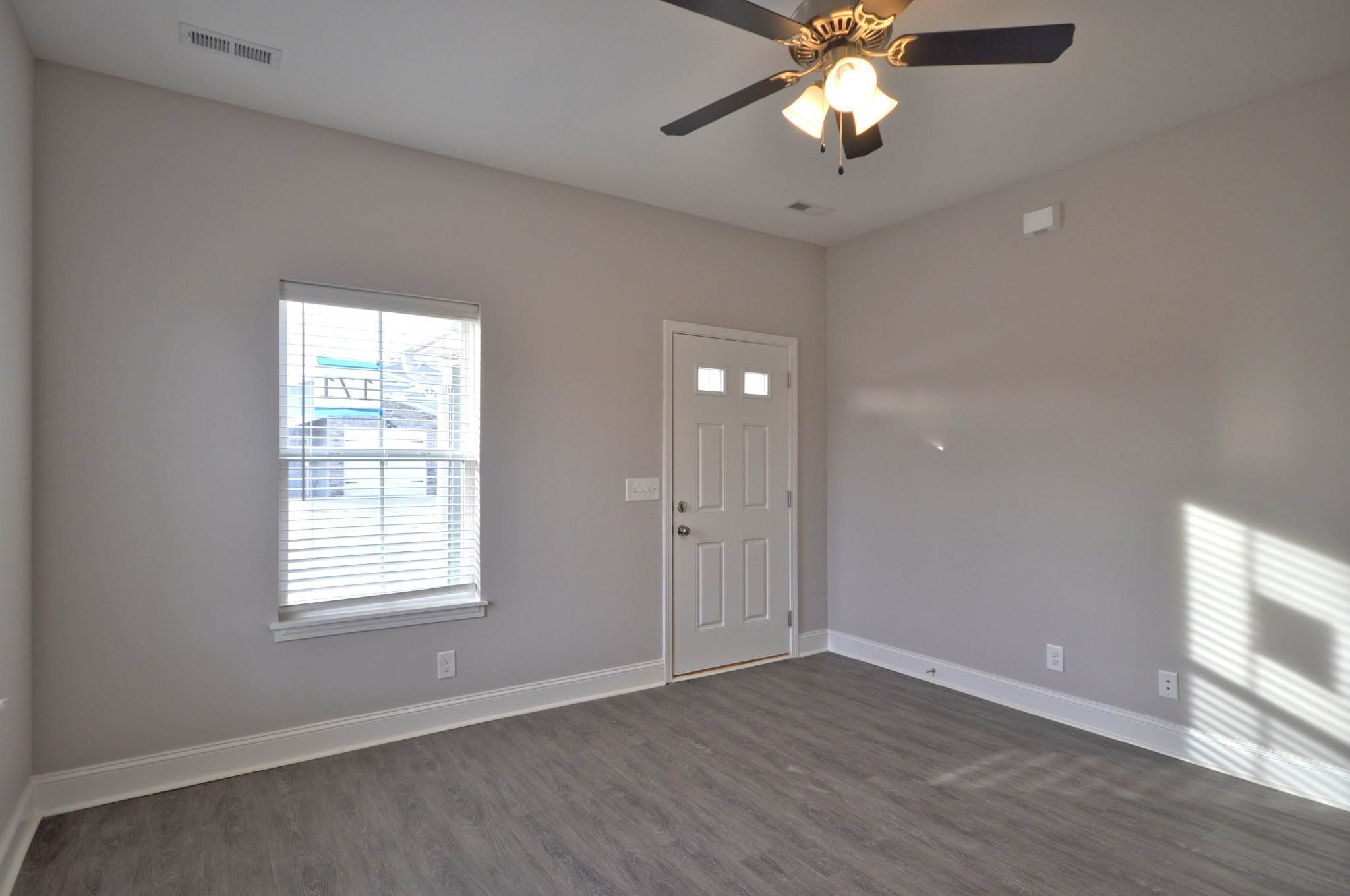 174 Bainbridge Drive, Unit A Clarksville, TN 37043 - Photo 7 of 36 wooden floor in an empty room with a window