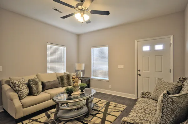 a living room with furniture and a window