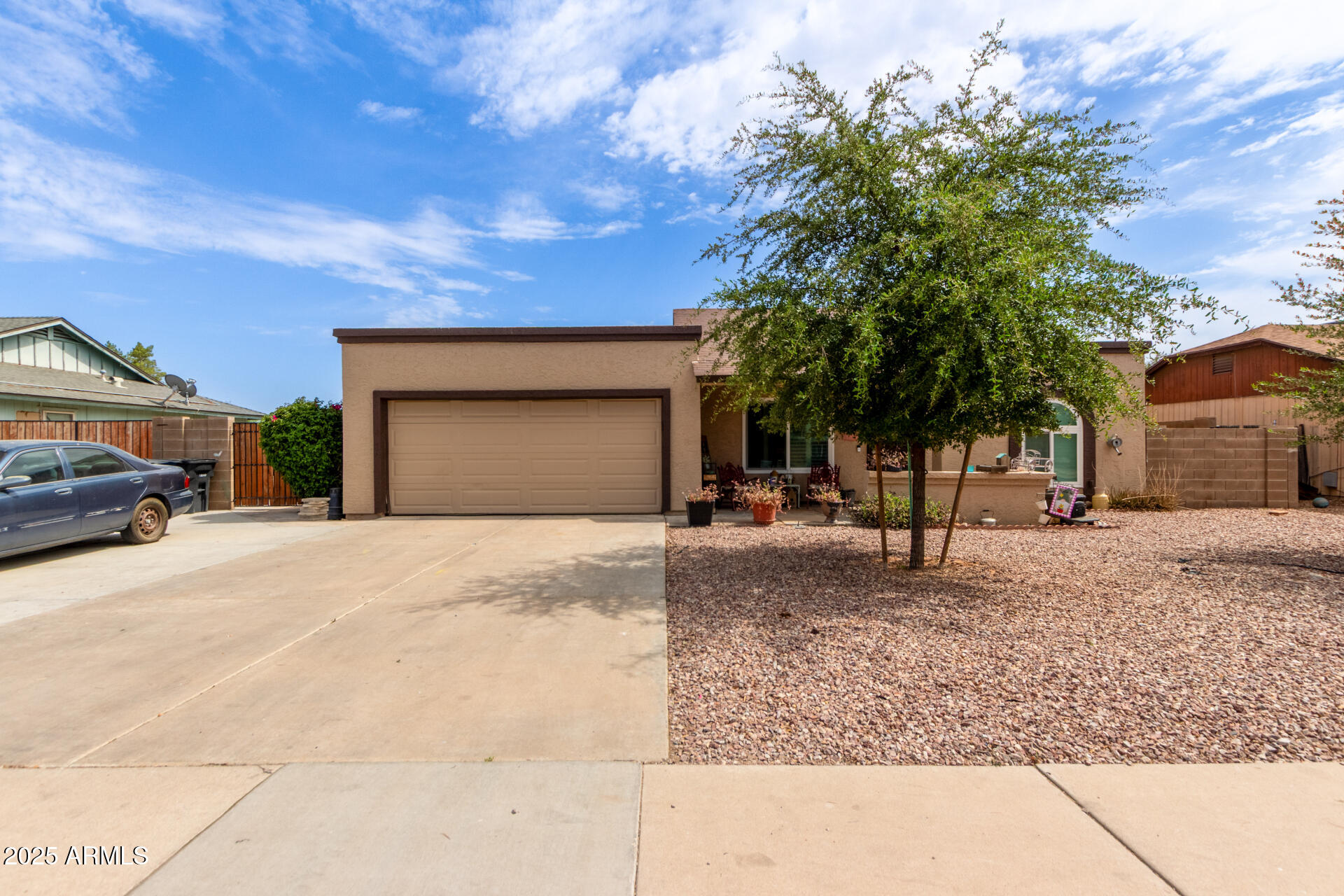 317 East Harwell Road Gilbert, AZ 85234 - Photo 1 of 29 a front view of a house with a yard