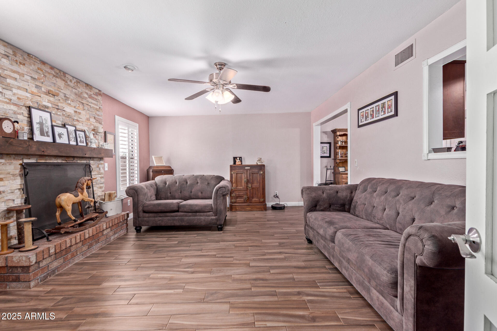 317 East Harwell Road Gilbert, AZ 85234 - Photo 13 of 29 a living room with furniture and a fireplace