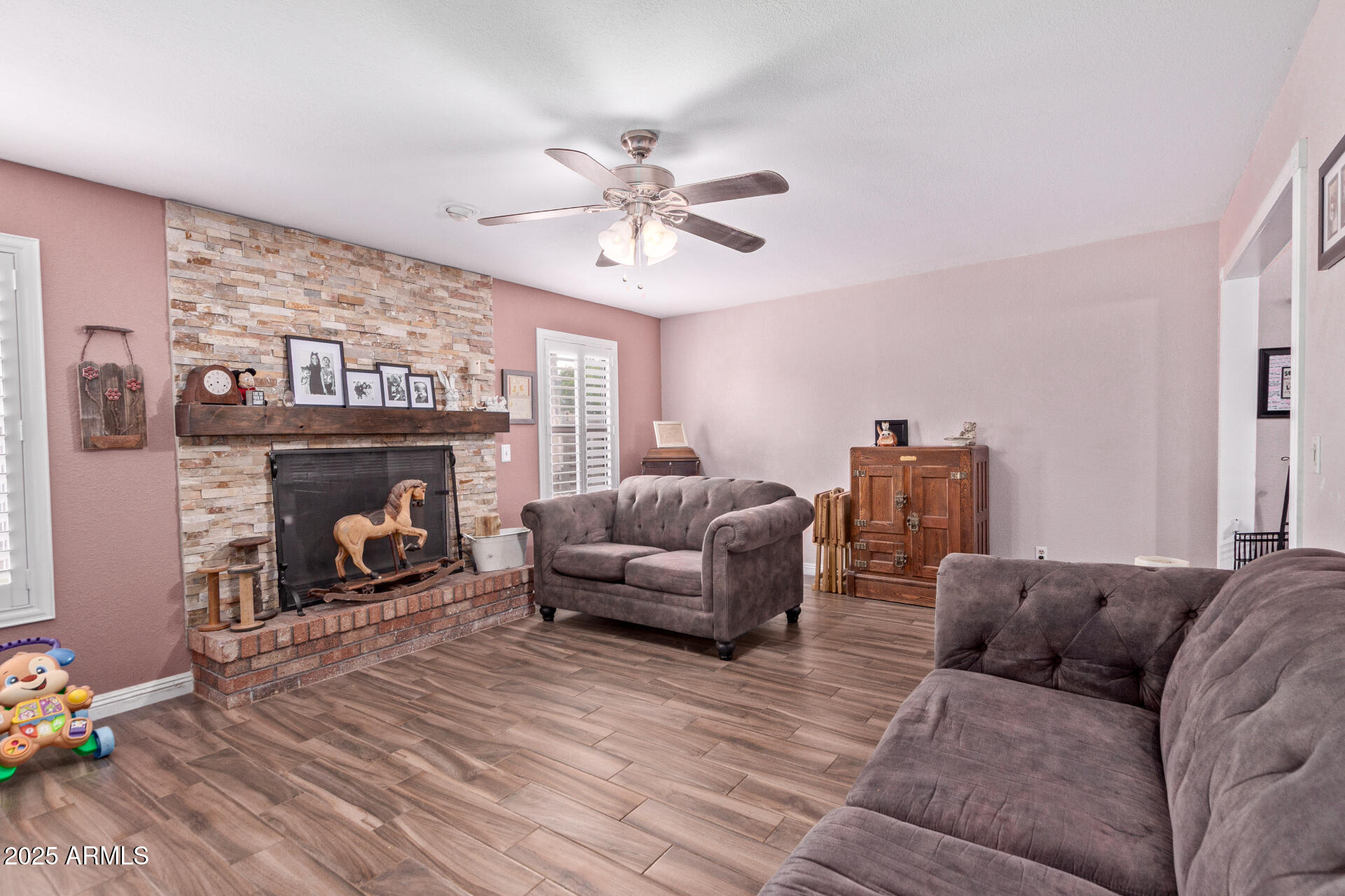 317 East Harwell Road Gilbert, AZ 85234 - Photo 14 of 29 a living room with furniture and a fireplace