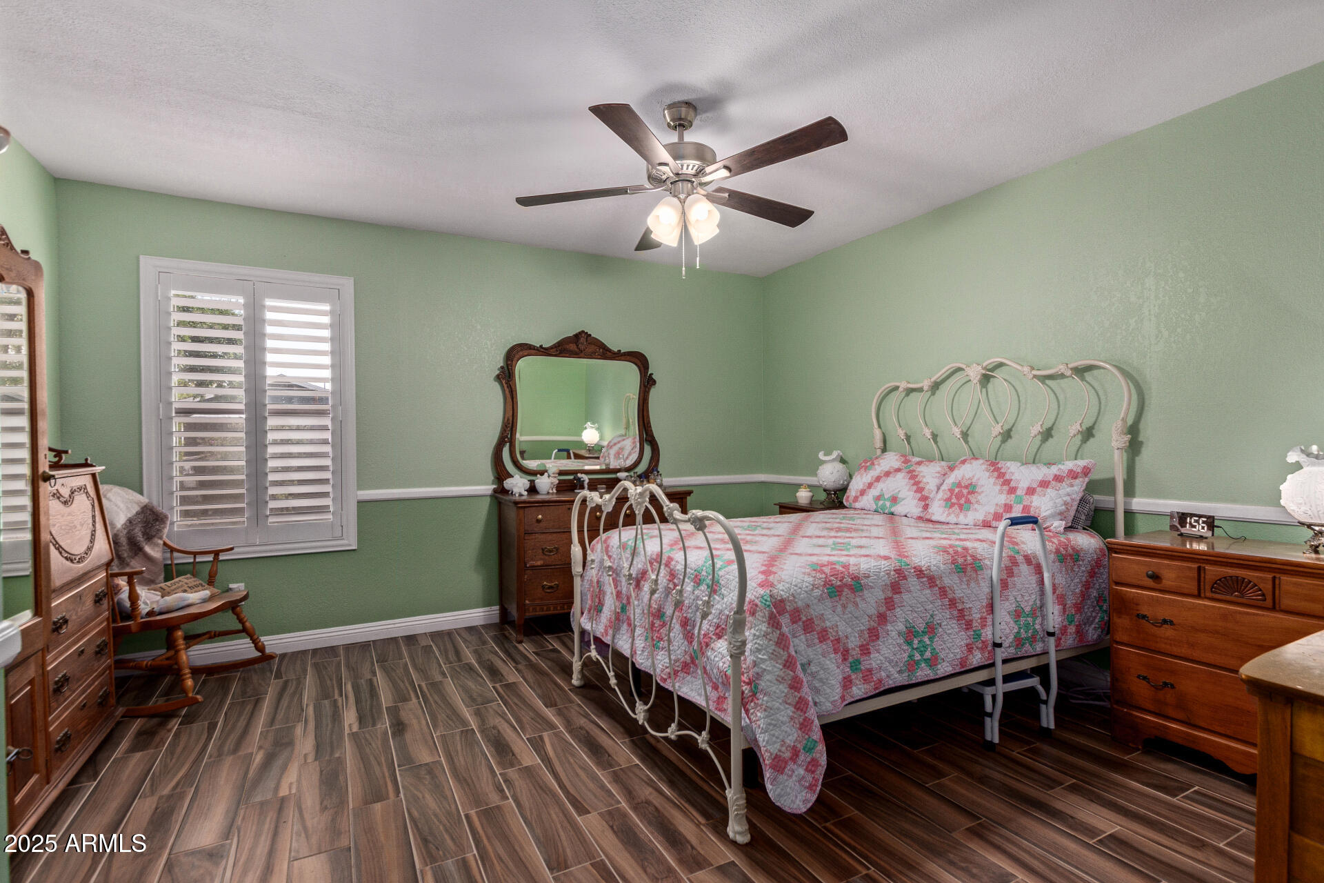 317 East Harwell Road Gilbert, AZ 85234 - Photo 15 of 29 a bedroom with a bed and a chandelier