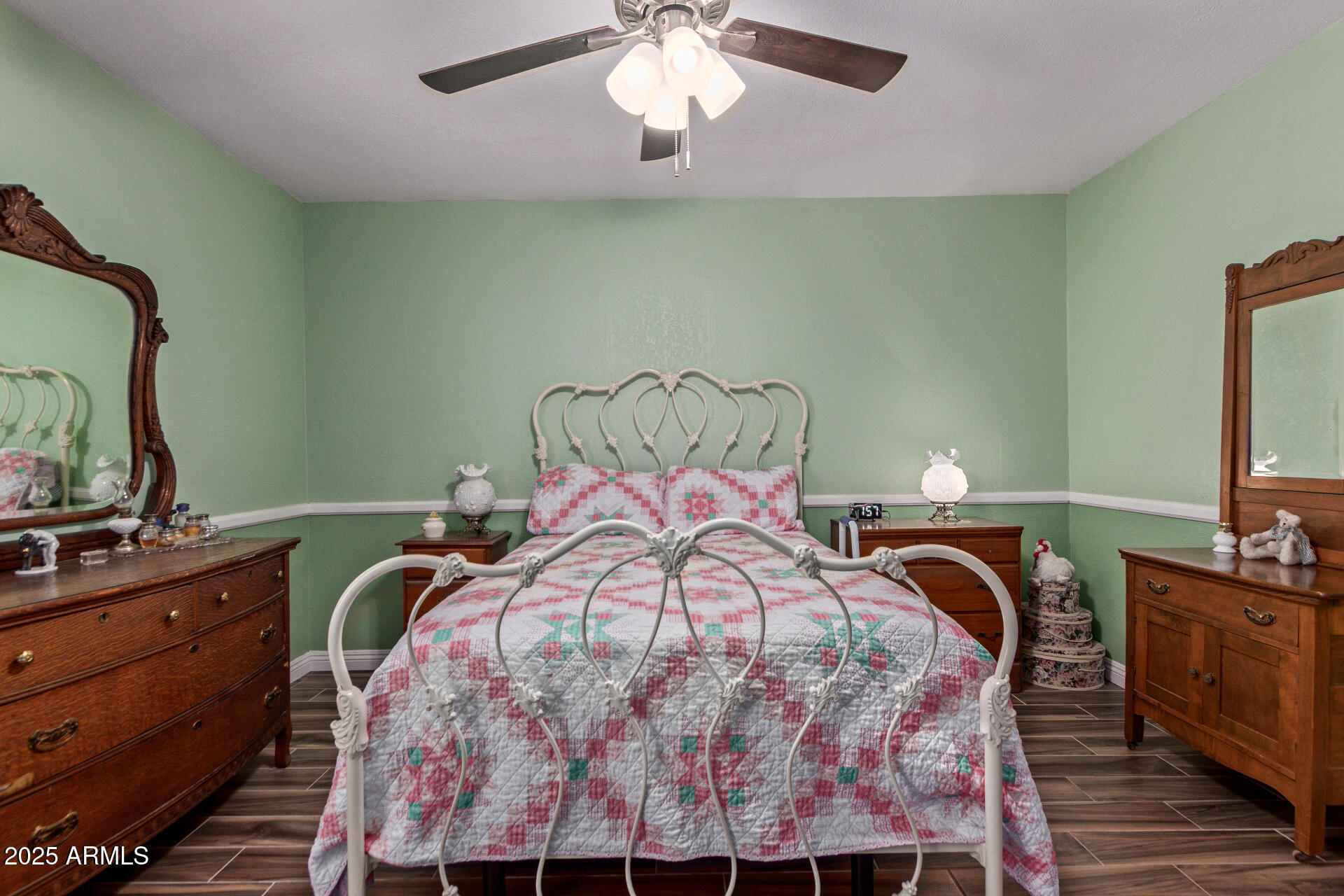 317 East Harwell Road Gilbert, AZ 85234 - Photo 16 of 29 a bedroom with a bed and a chandelier