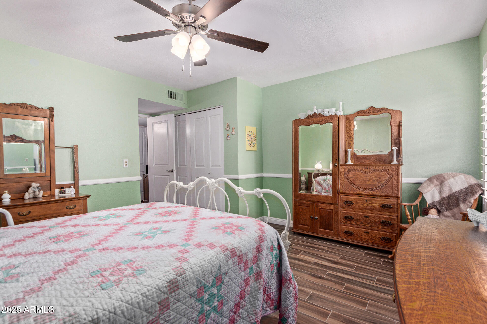 317 East Harwell Road Gilbert, AZ 85234 - Photo 17 of 29 a bedroom with a bed a chandelier and dresser