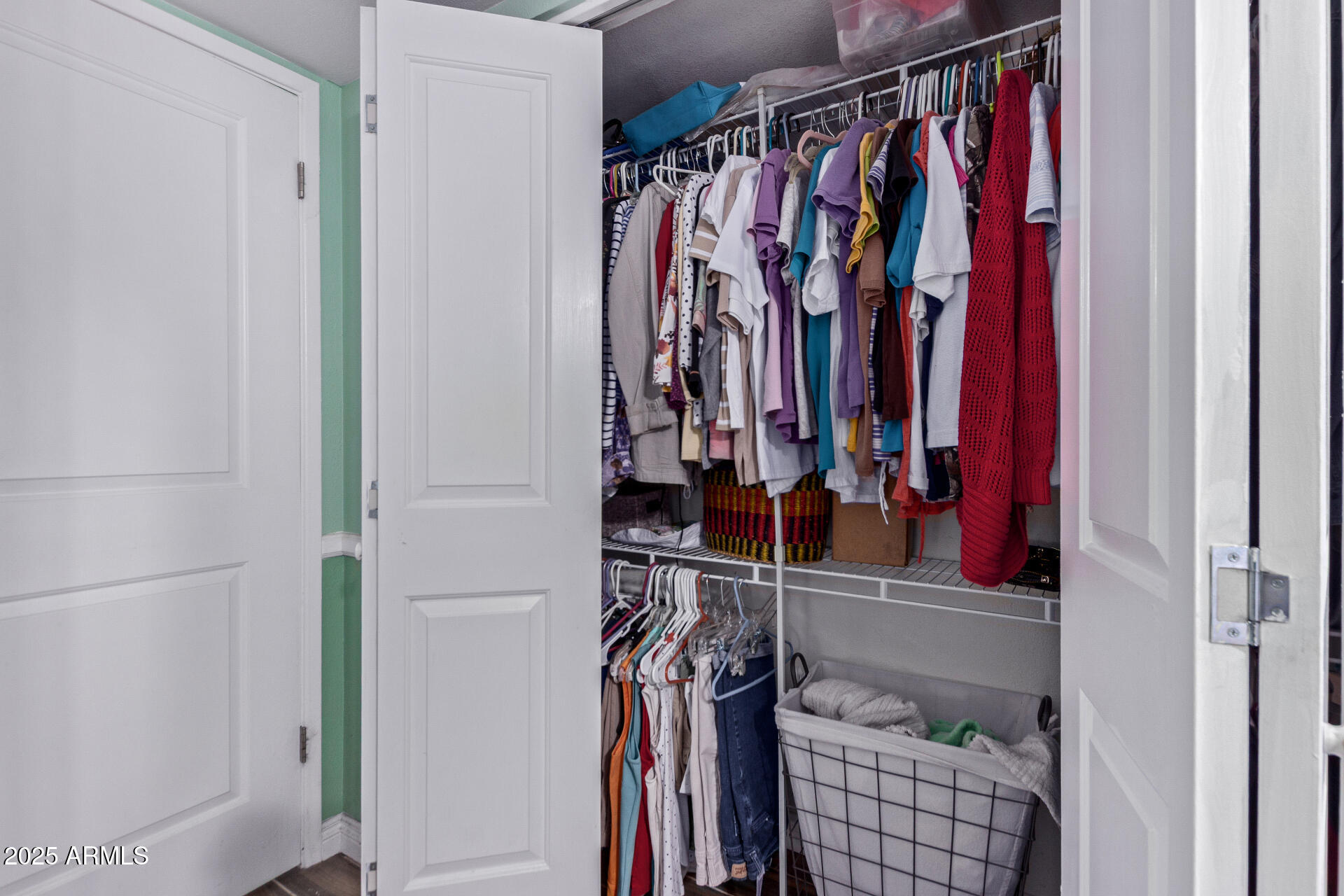 317 East Harwell Road Gilbert, AZ 85234 - Photo 19 of 29 a view of walk in closet with clothes