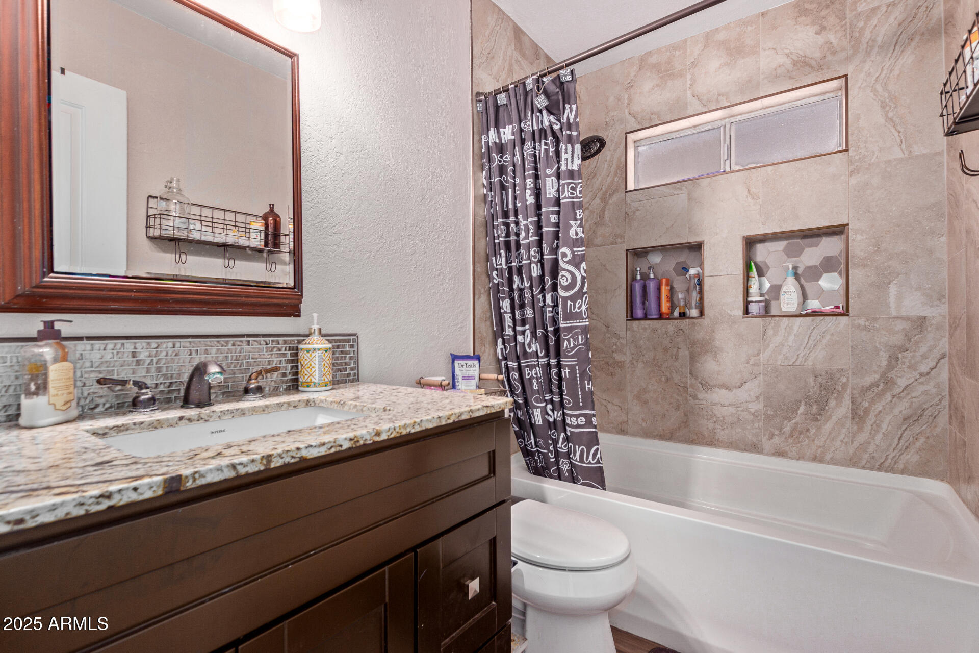 317 East Harwell Road Gilbert, AZ 85234 - Photo 22 of 29 a bathroom with a granite countertop bathtub sink vanity mirror and toilet