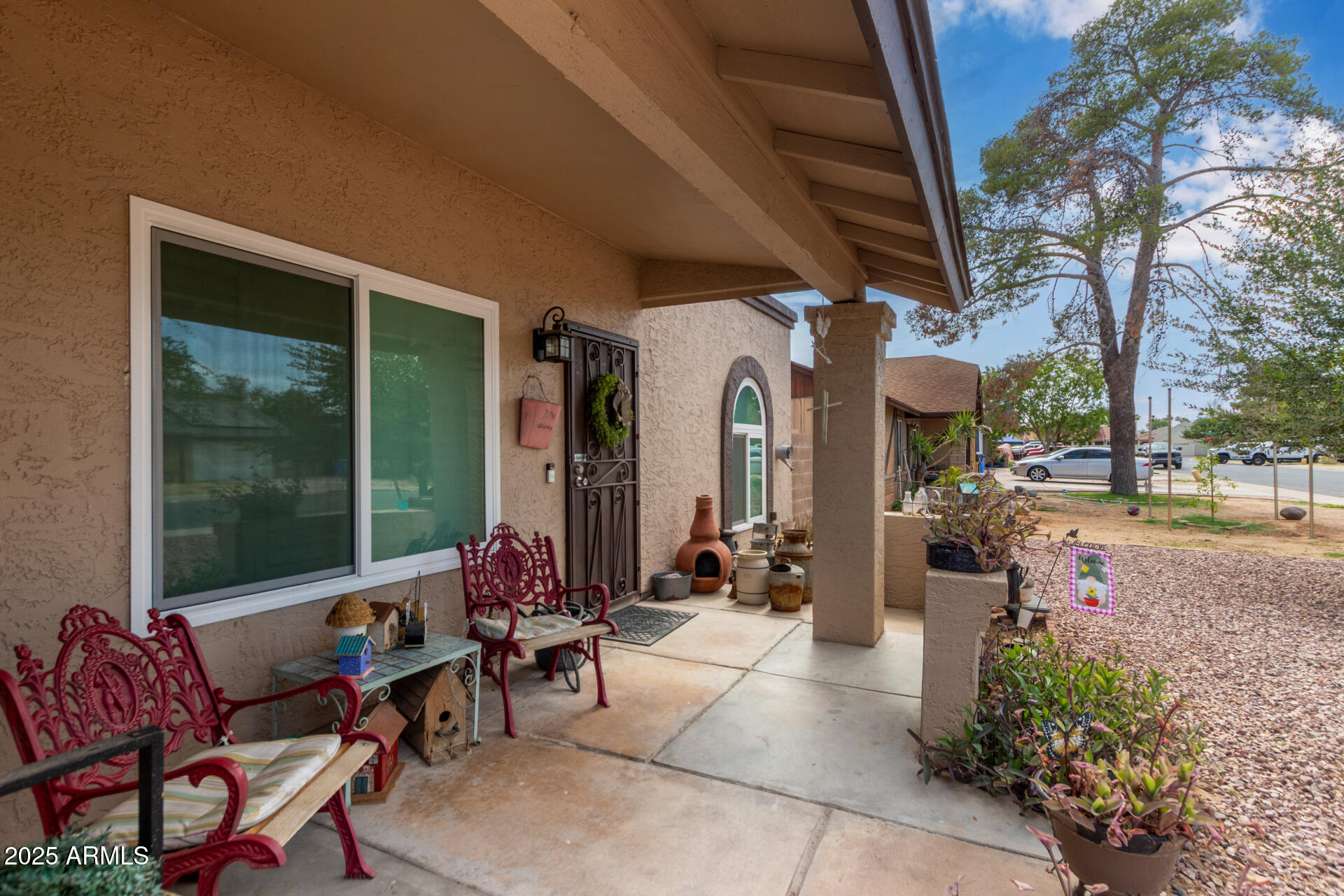 317 East Harwell Road Gilbert, AZ 85234 - Photo 4 of 29 a building outdoor space with patio furniture and potted plants