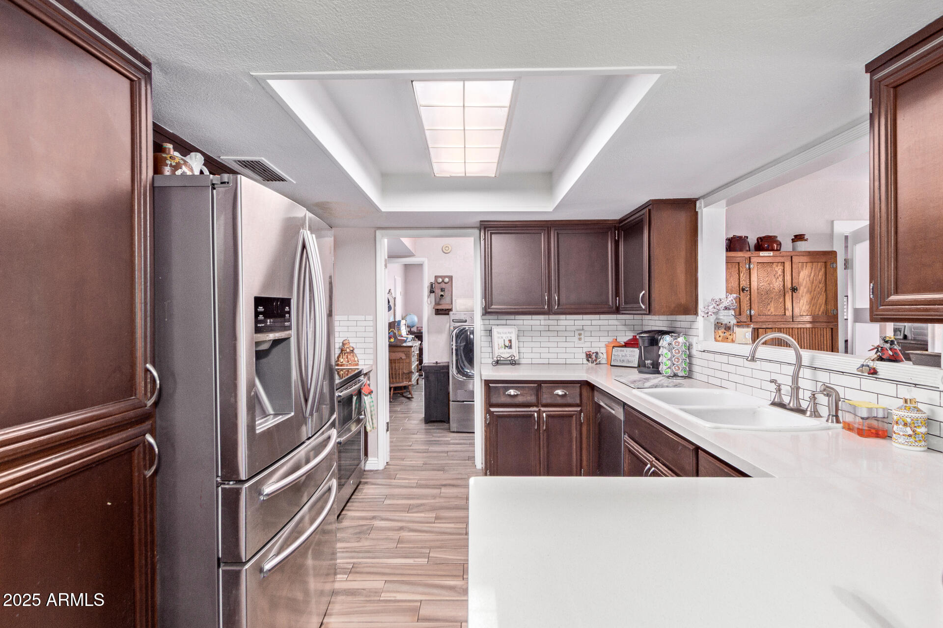 317 East Harwell Road Gilbert, AZ 85234 - Photo 8 of 29 a kitchen with stainless steel appliances granite countertop a refrigerator and a sink