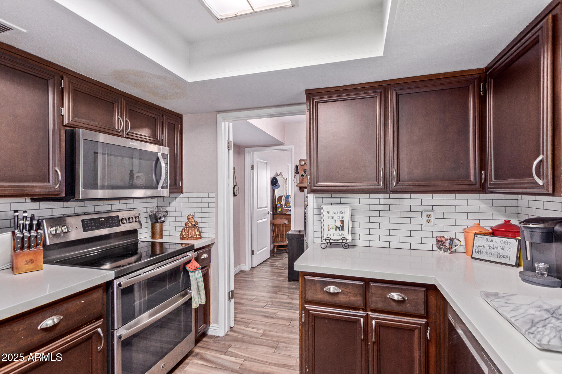 317 East Harwell Road Gilbert, AZ 85234 - Photo 9 of 29 a kitchen with stainless steel appliances granite countertop a sink stove and cabinets
