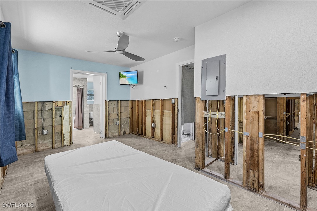 4826 East Riverside Drive Fort Myers, FL 33905 - Photo 18 of 34 a large bedroom with a bed closet and wooden floor