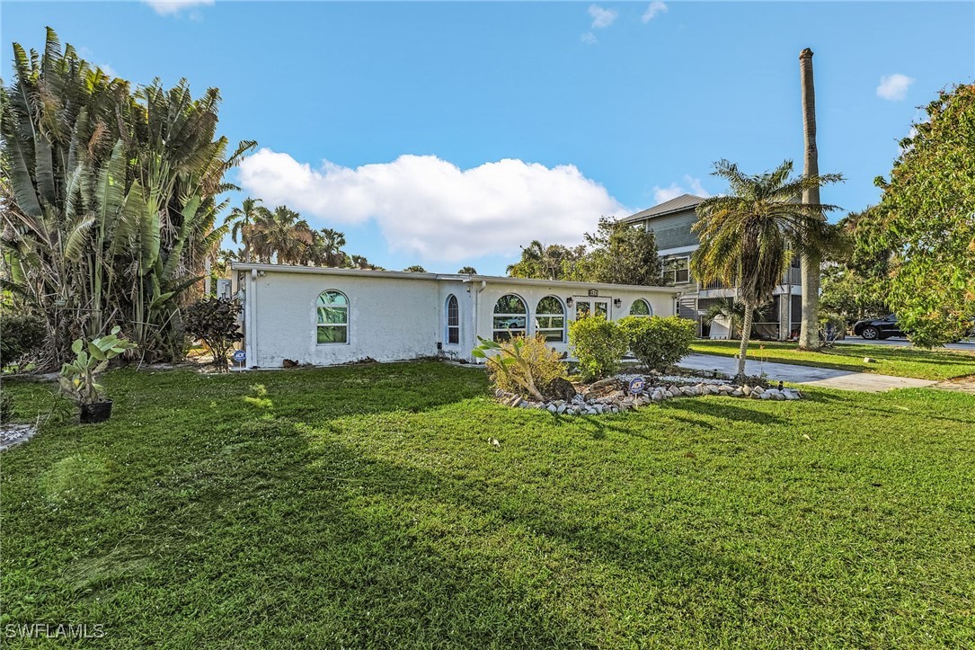 4826 East Riverside Drive Fort Myers, FL 33905 - Photo 30 of 34 a view of a house with a backyard