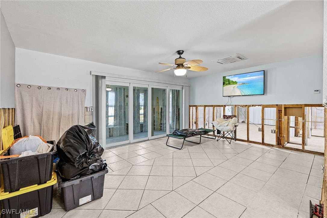 4826 East Riverside Drive Fort Myers, FL 33905 - Photo 9 of 34 a living room with furniture and a window