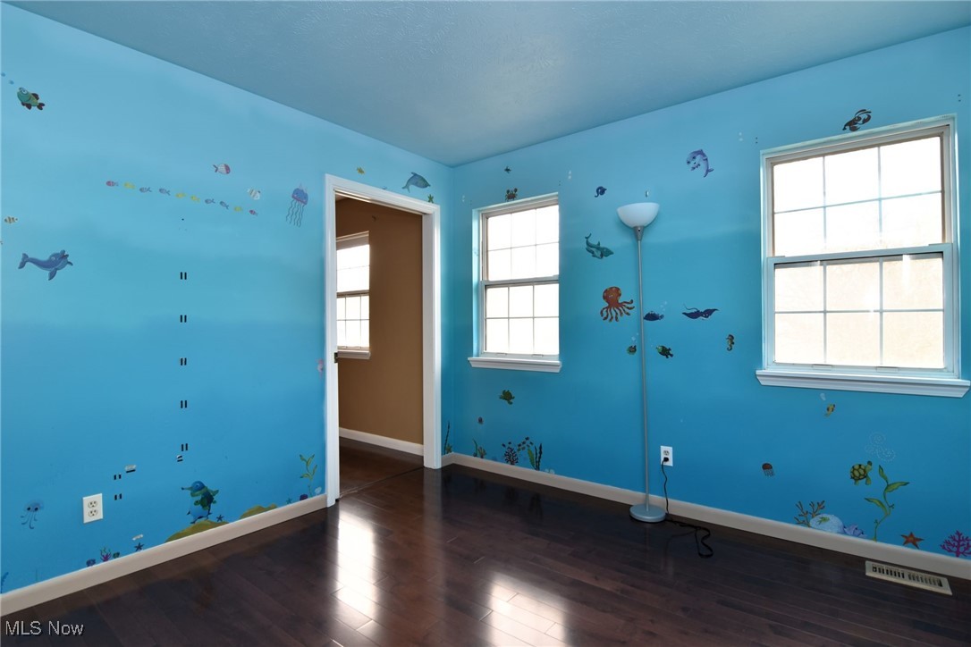 4985 Corliss Road Cleveland, OH 44124 - Photo 20 of 33 BR next to main bedroom with separate hall entry and new hardwood floor