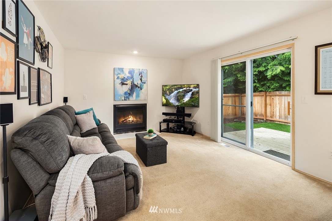 4010 Northeast 19th Street Renton, WA 98056 - Photo 12 of 25 a living room with furniture large window and a flat screen tv