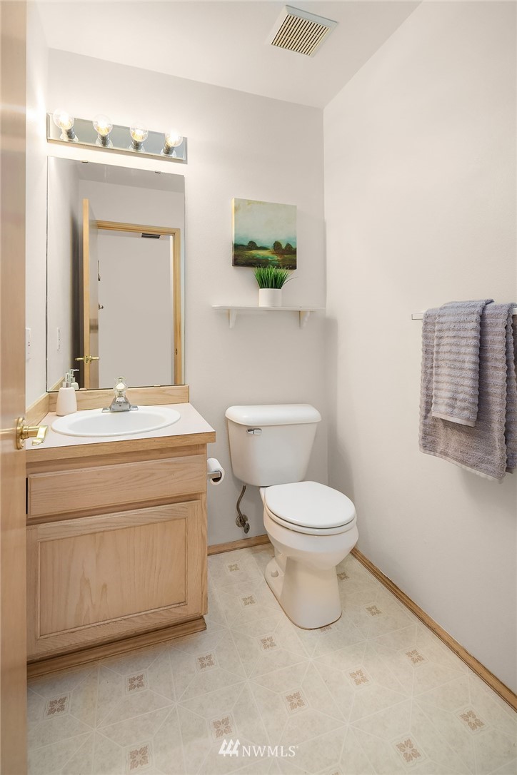 4010 Northeast 19th Street Renton, WA 98056 - Photo 14 of 25 a bathroom with a toilet sink and mirror