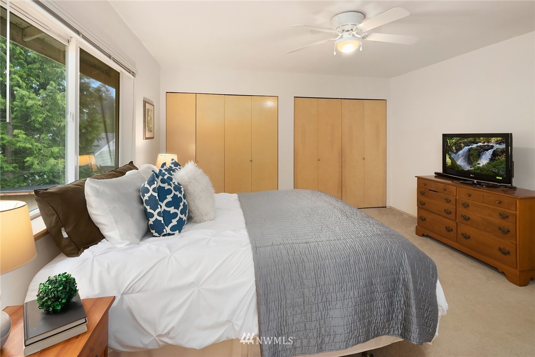 4010 Northeast 19th Street Renton, WA 98056 - Photo 16 of 25 a bed sitting in a bedroom next to a window