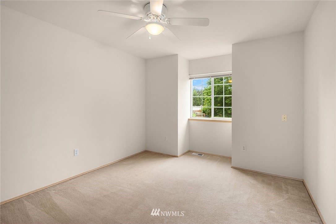 4010 Northeast 19th Street Renton, WA 98056 - Photo 19 of 25 an empty room with a window and a fan