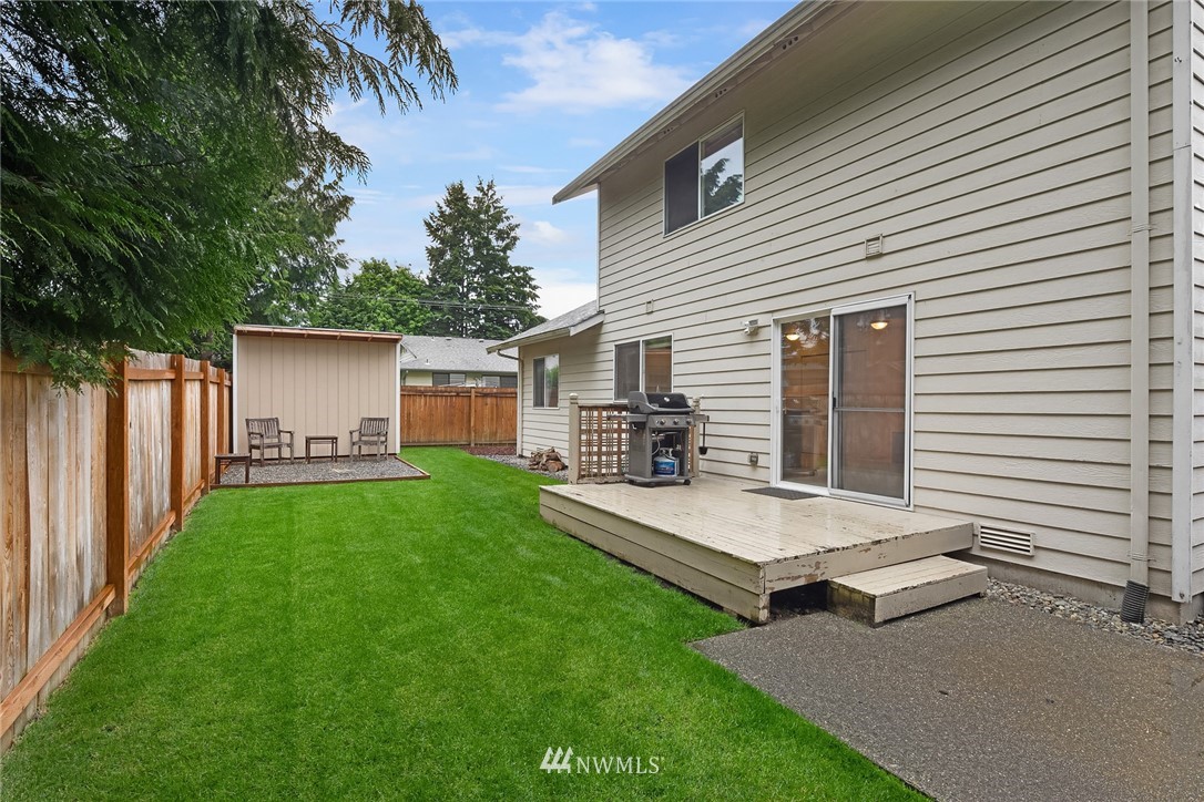 4010 Northeast 19th Street Renton, WA 98056 - Photo 21 of 25 a backyard of a house with table and chairs