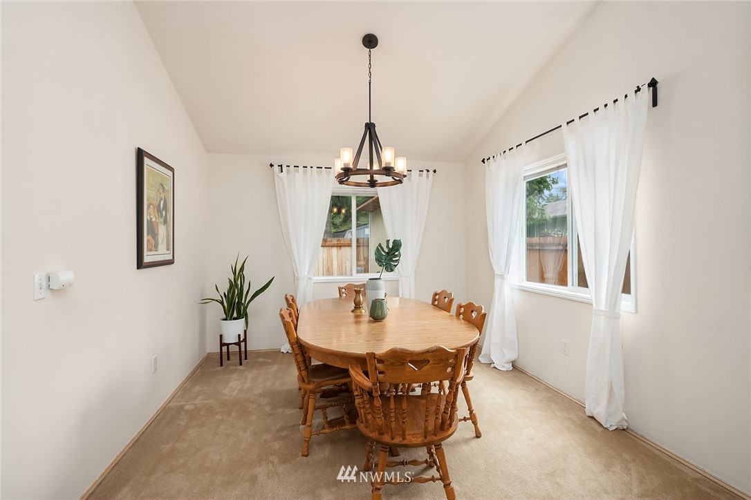 4010 Northeast 19th Street Renton, WA 98056 - Photo 5 of 25 a dining room with furniture a chandelier and window