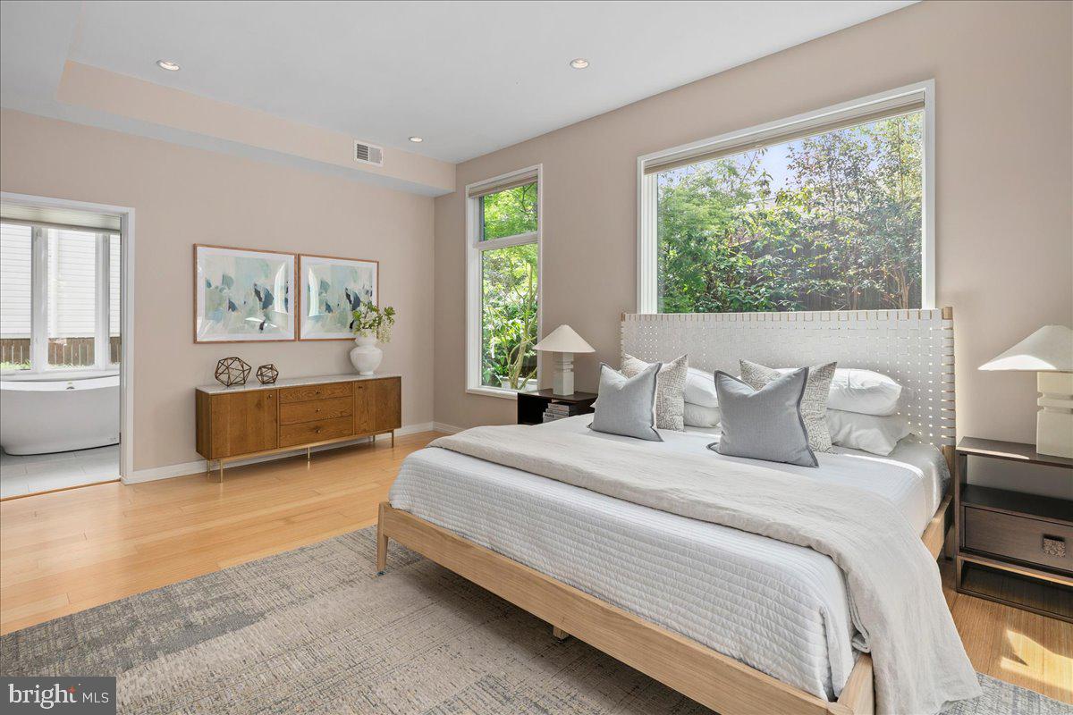 4324 Rosedale Avenue Bethesda, MD 20814 - Photo 29 of 73 Serene bedroom with lush garden views.