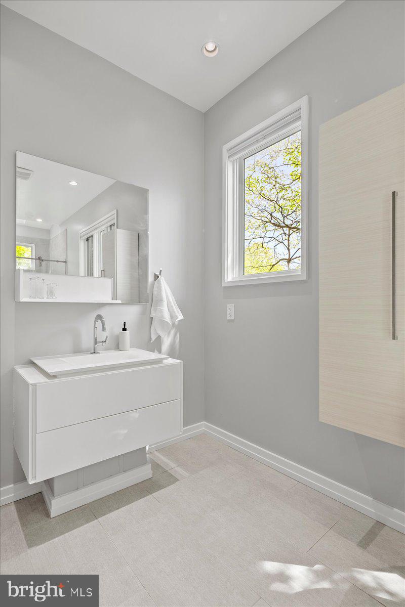 4324 Rosedale Avenue Bethesda, MD 20814 - Photo 34 of 73 Sleek modern bathroom with natural light.