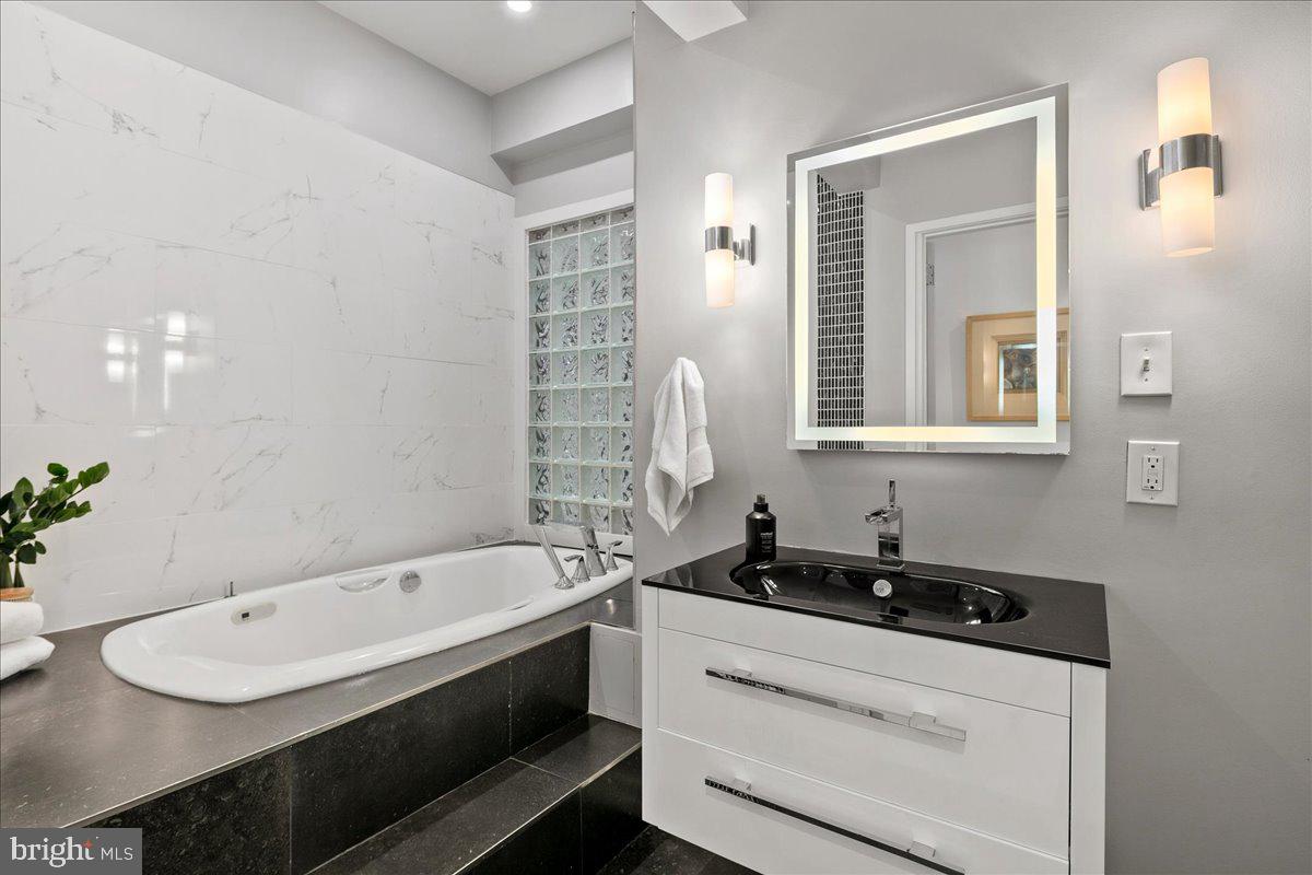 4324 Rosedale Avenue Bethesda, MD 20814 - Photo 38 of 73 Sleek modern bathroom oasis.