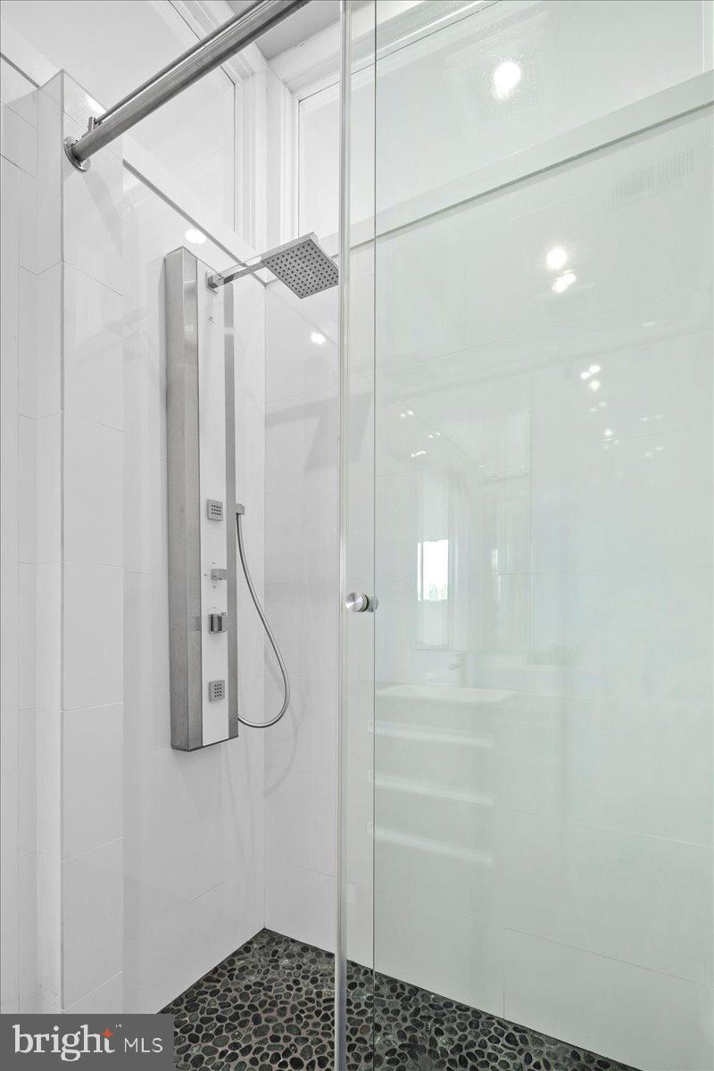 4324 Rosedale Avenue Bethesda, MD 20814 - Photo 50 of 73 Sleek modern shower with pebble floor.