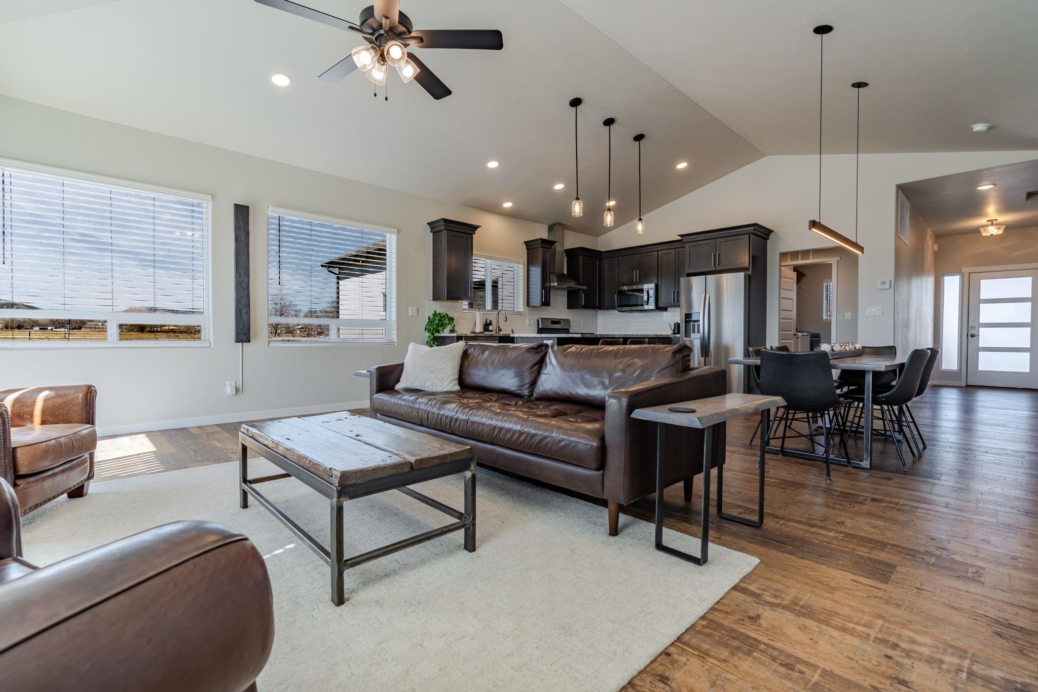 1301 M Road Loma, CO 81524 - Photo 3 of 32 a living room with furniture kitchen view and a chandelier
