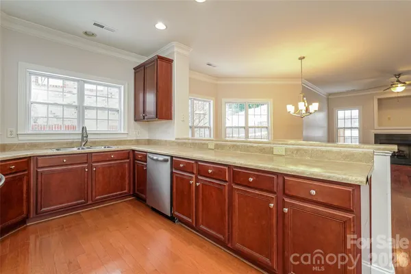 a spacious bathroom with a granite countertop sink and a large mirror