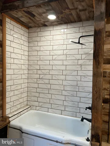 a bathroom with a sink and a large mirror