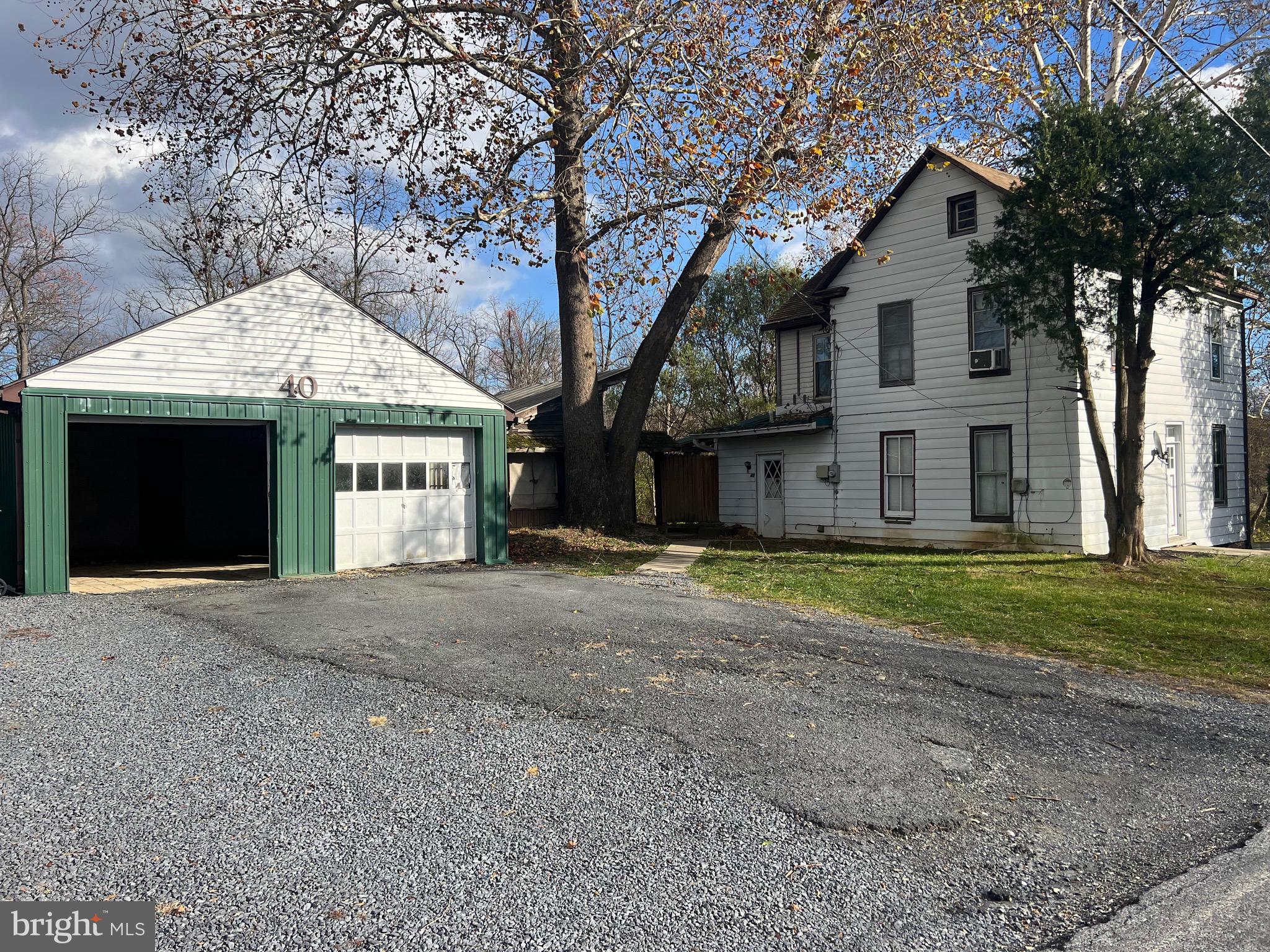40 North Fileys Road Dillsburg, PA 17019 - Photo 2 of 25 a front view of a house with a yard and large tree