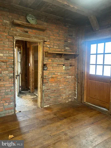 a view of front door of house with a yard