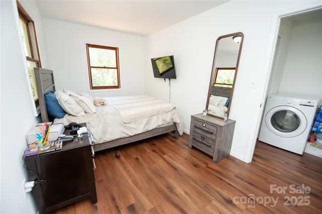 a bedroom with bed and a window