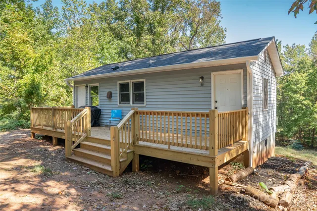 a view of backyard with a deck